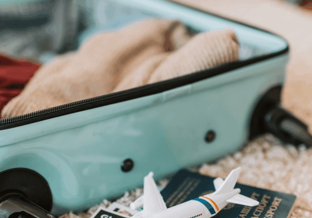 Open suitcase with passport